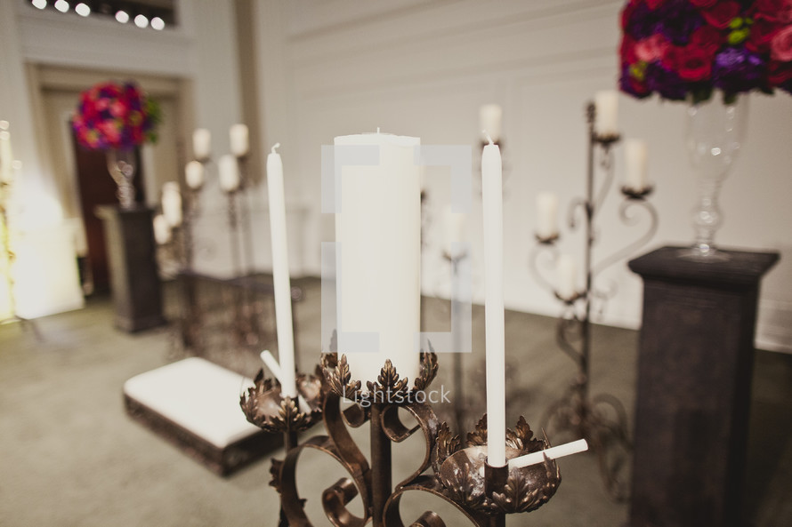 A unity candle at the altar awaits the bride and groom.