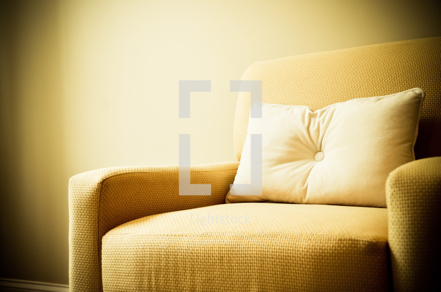 pillow on a yellow couch