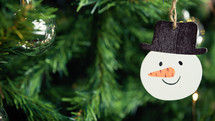 Snowman decoration on a Christmas tree