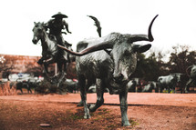 lone horn statue and cowboy 