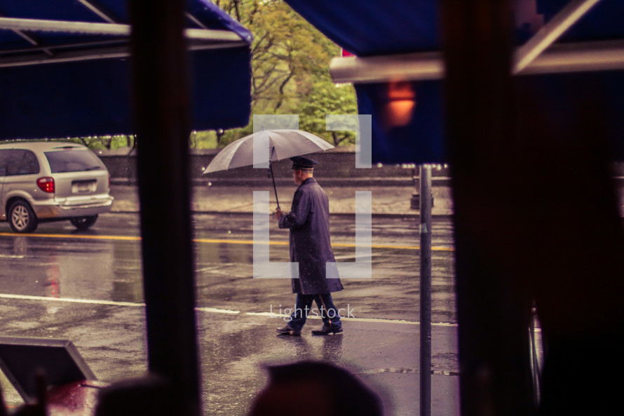ballet carrying an umbrella in the rain 