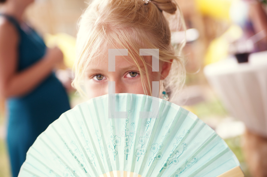 girl behind Chinese fan