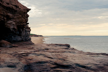 rocks and cliffs along a shoreline 