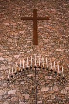 candelabra and cross at an altar 