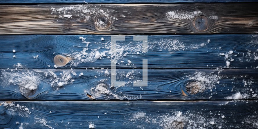 Wooden planks covered with snow. Winter background.