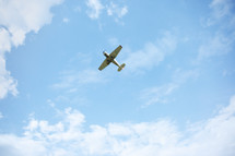 small airplane in the sky 