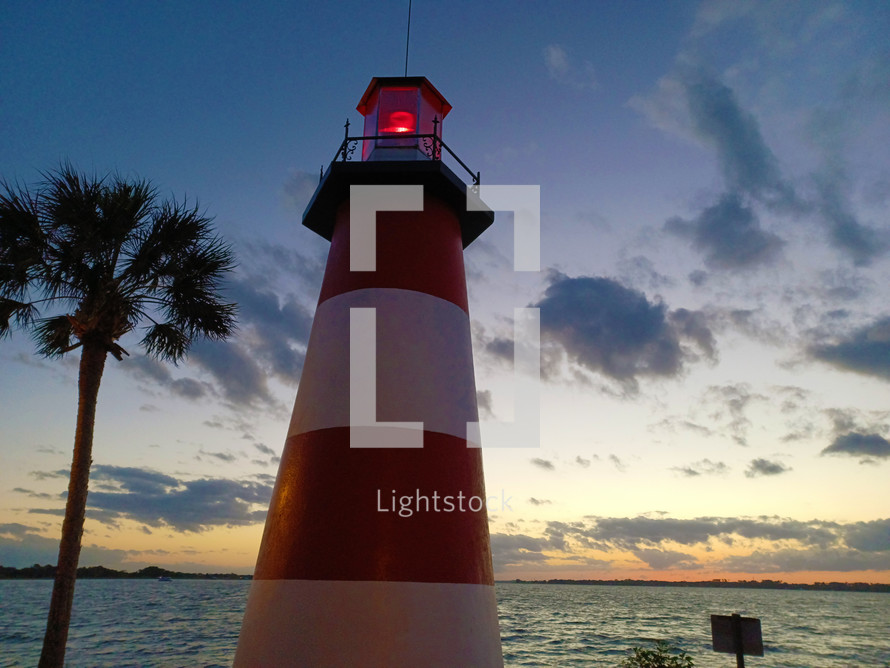 red and white striped lighthouse 