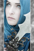 Queen of Narnia; woman in blue with blue eyes holding a sword.