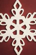 White snowflake on a red background