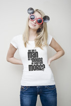 Man or a Mouse; woman with mouse glasses wearing jeans and shirt that reads 'Are you a man or a mouse or something more?'