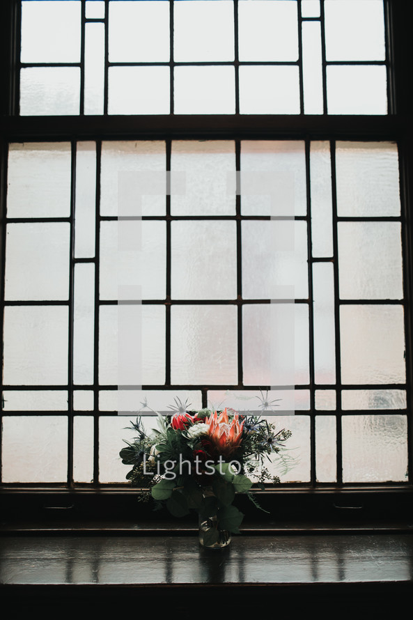 floral arrangement in a window 