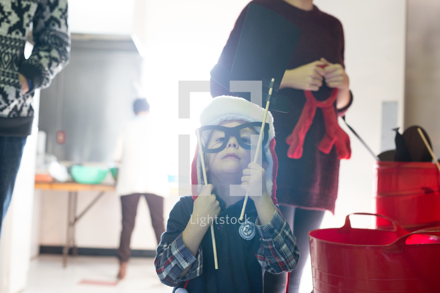 a boy child playing dress-up