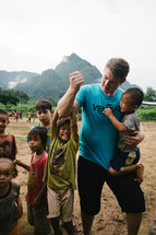 missionary and the faces of young children 