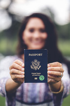 a woman holding a passport 