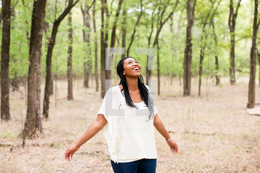 open arms, woman, standing, outdoors, rejoicing, joy, African American 