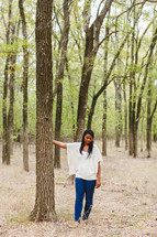 African American woman alone in a forest 