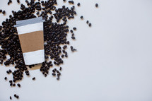 coffee beans and paper coffee cup 
