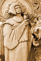 Saint France sculpture ministering to a bird. 