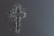 cross in ashes on a black background 