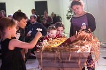 children playing flowers in a manger 