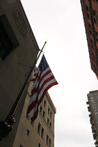 American flag on the side of a city building 