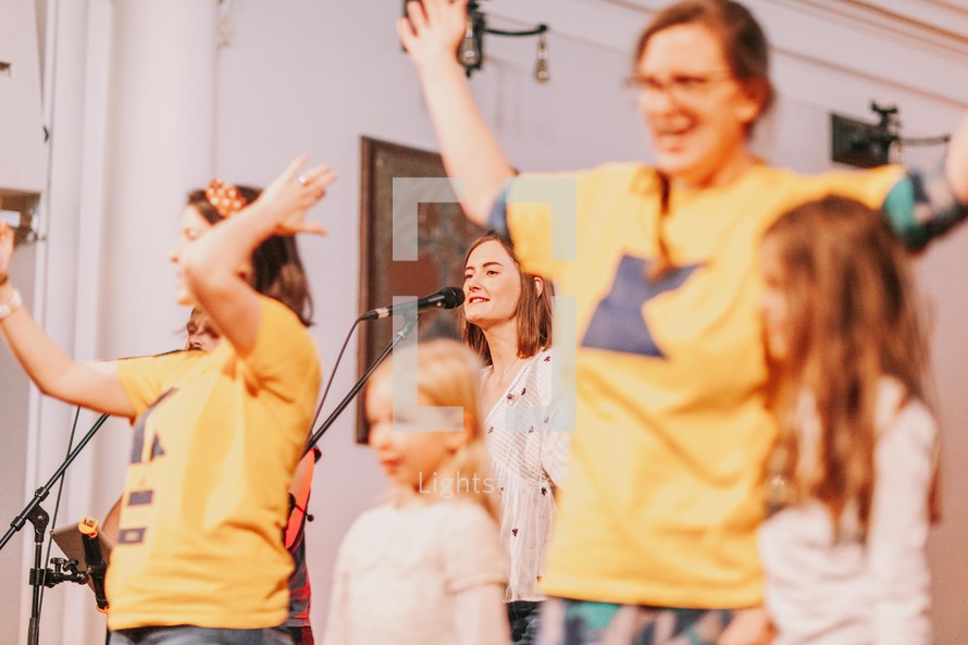 children singing during a worship service 