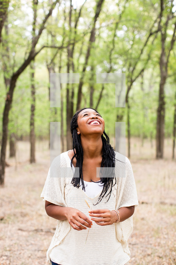 African American woman looking up to God 