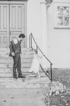 father and daughter walking up church steps 