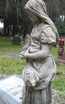 praying angel at a gravesite 