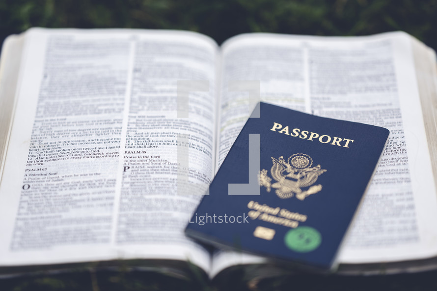 passport on an open Bible 