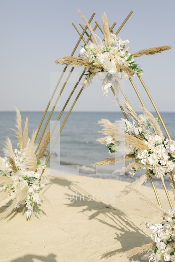 Wedding ceremony floral backdrop.