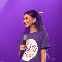 teen girl holding a microphone 
