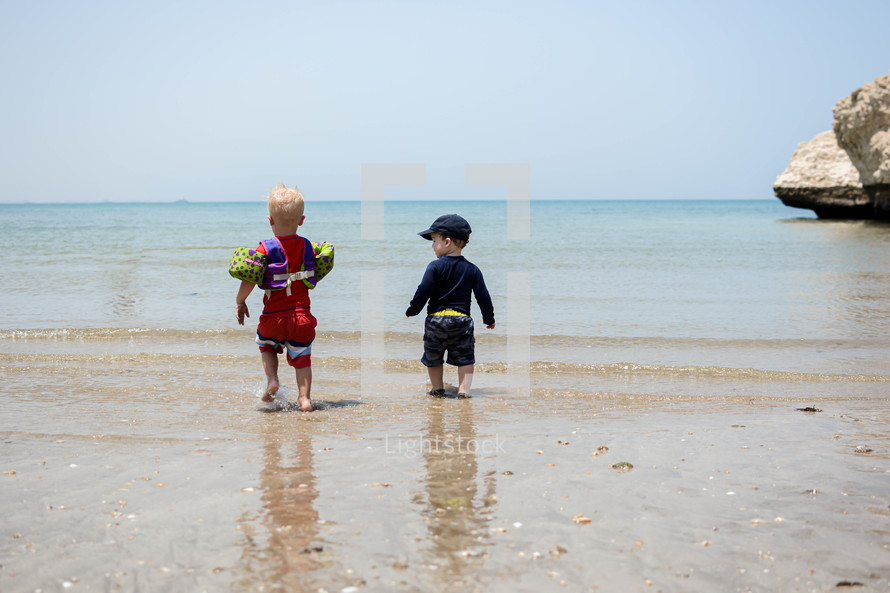 Kids playing on a beach in Muscat, Oman