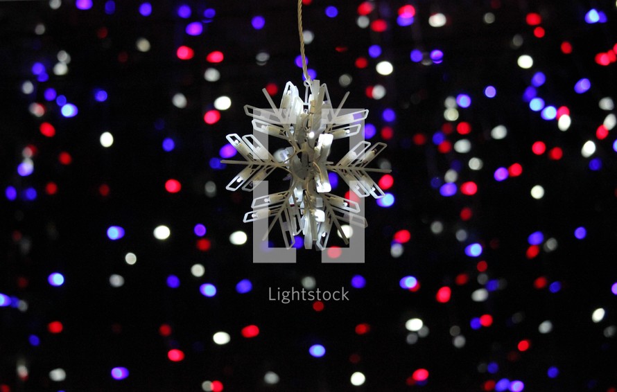 snowflake ornament and red, white, and blue lights 