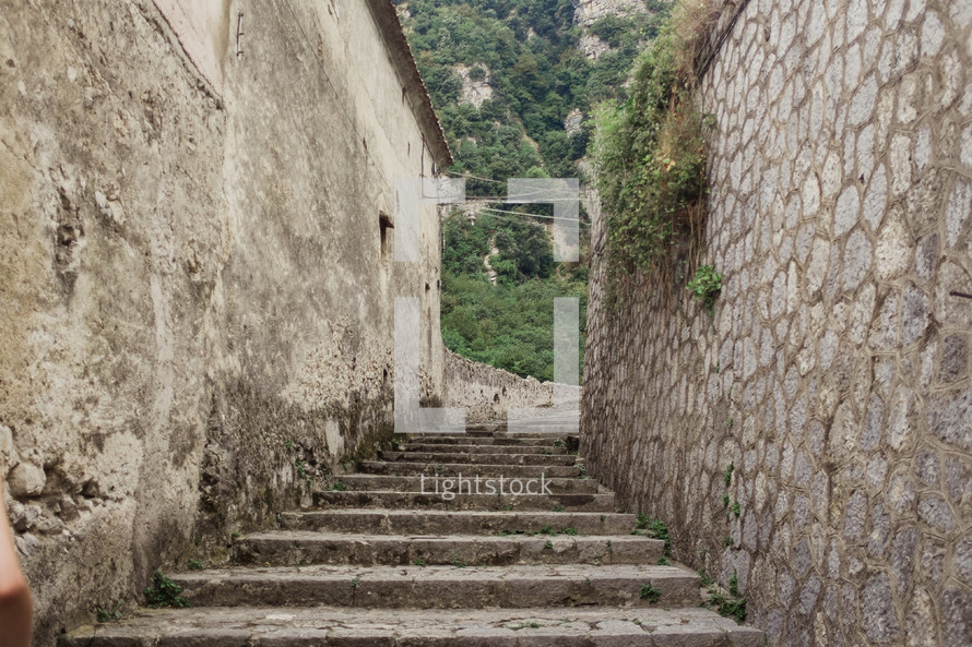 steps through narrow alley in Italy