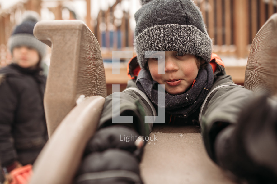 kids playing in the backyard in winter 