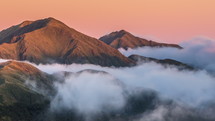 Sunrise in mountains nature above clouds in New Zealand landscape Time lapse
