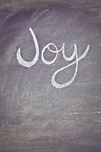 Joy written on a chalkboard