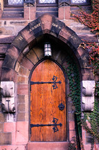 A side door into the Old Dutch Church in the Stockade district of Schenectady, New York in the mid-1980s. The inscription over the door reads; "His banner over me was love." 