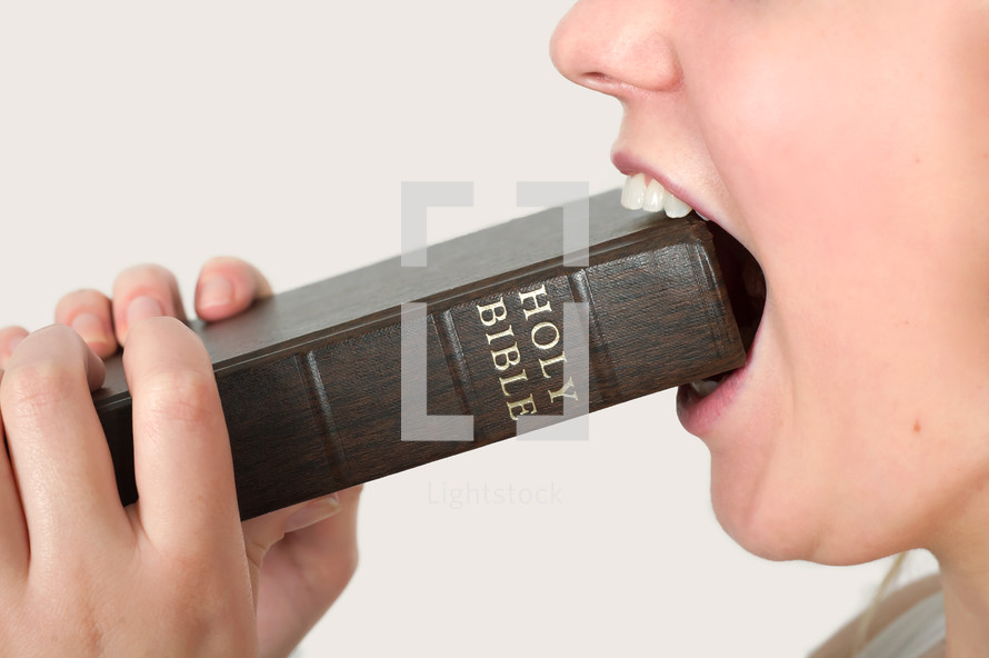 A Bible in a woman's mouth 