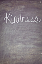 kindness written on a chalkboard