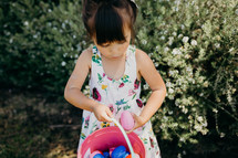 A little girl on an Easter egg hunt 
