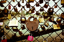 locks on a chain linked fence