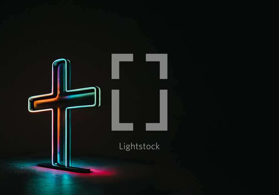 Neon cross on a black background with text space