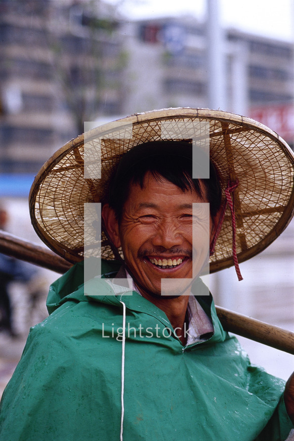 Chinese fisherman in a straw hat {Also try search for 'Ethnic Faces'} 