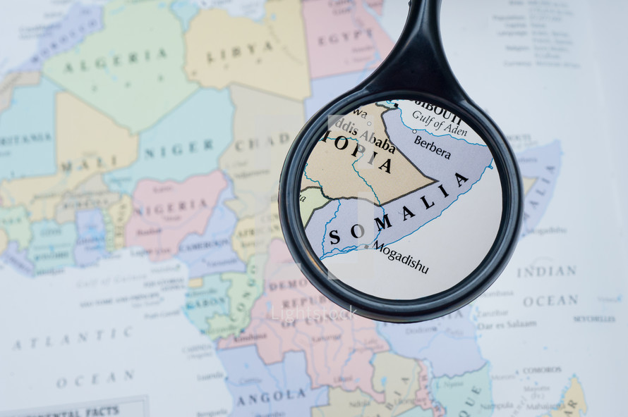 magnifying glass over a map of Somalia 