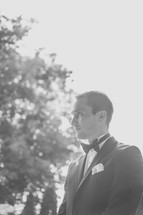 groom standing outdoors 