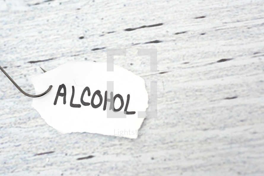 fish hook on paper with the word alcohol 