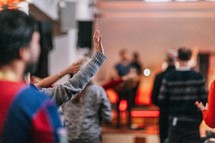 raised hands during a worship leader 