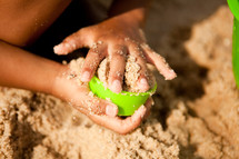 child playing in sand 